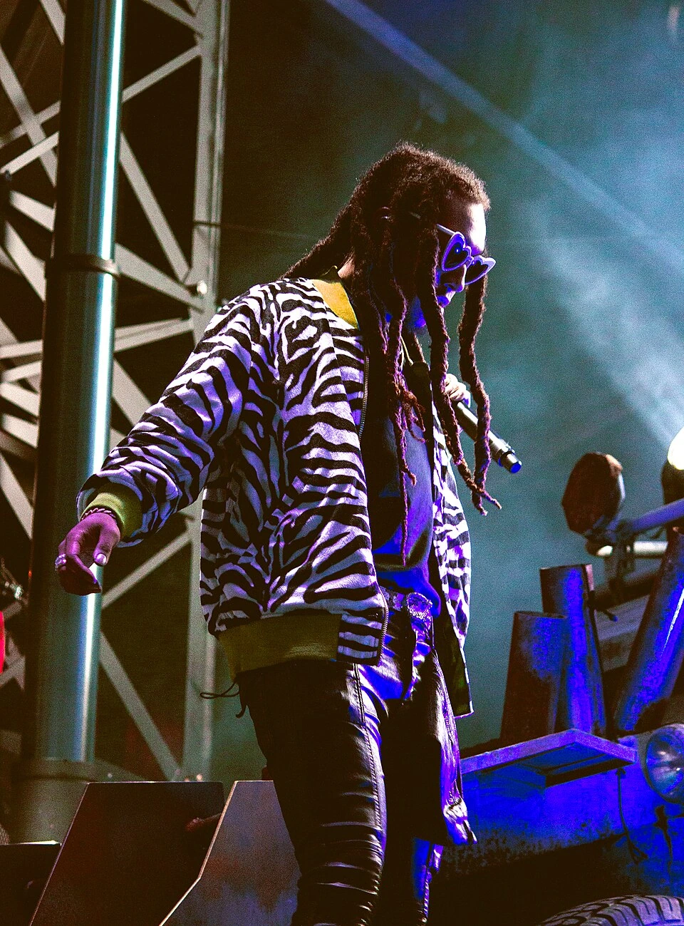 Takeoff performing with Migos on stage in 2017
