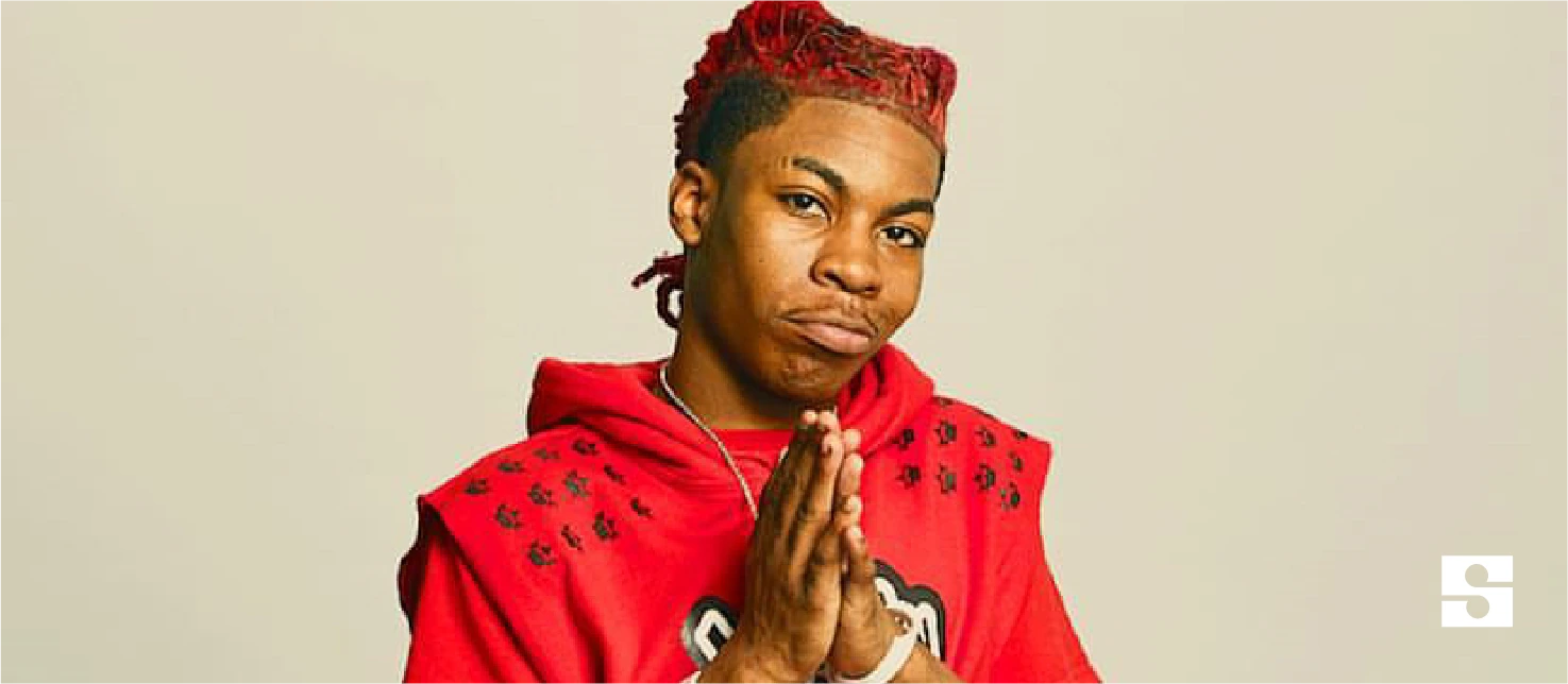 Portrait of Yvng Swag in a red hoodie against a plain background.