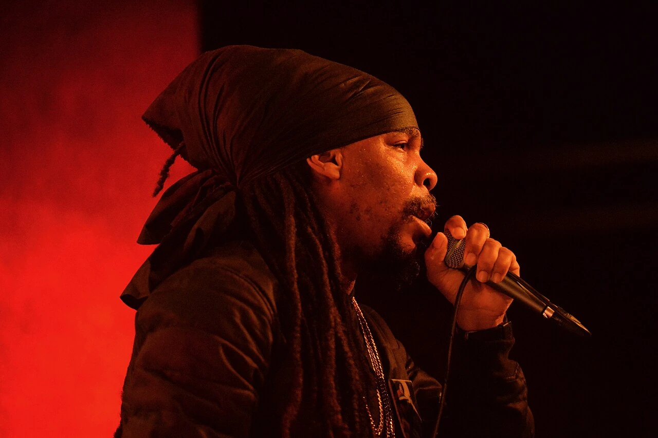 Turbulence performing on stage while singing into a microphone