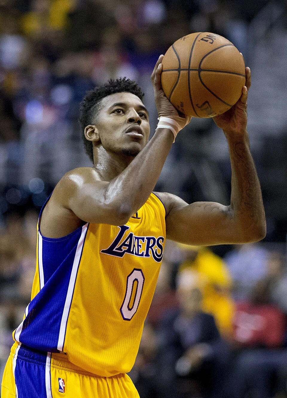 Nick Young in a Los Angeles Lakers uniform preparing a jump shot.